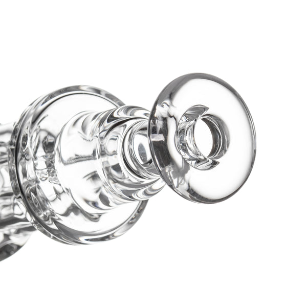 Close-up of Tetra - Clear glass adapter with a tiered shaft, flared mouth, ideal for airflow regulation in water-pipes or dab-rigs.