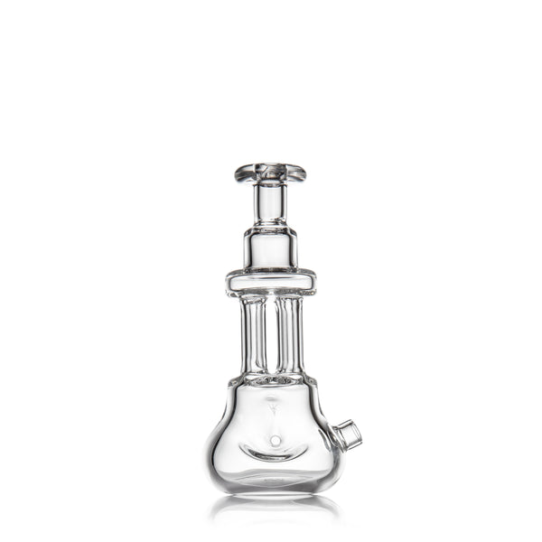 Tetra - Clear glass dab rig features a beaker base, two vertical percolator chambers, and a flared mouthpiece, showcasing a sleek, modern design for vaporizing.