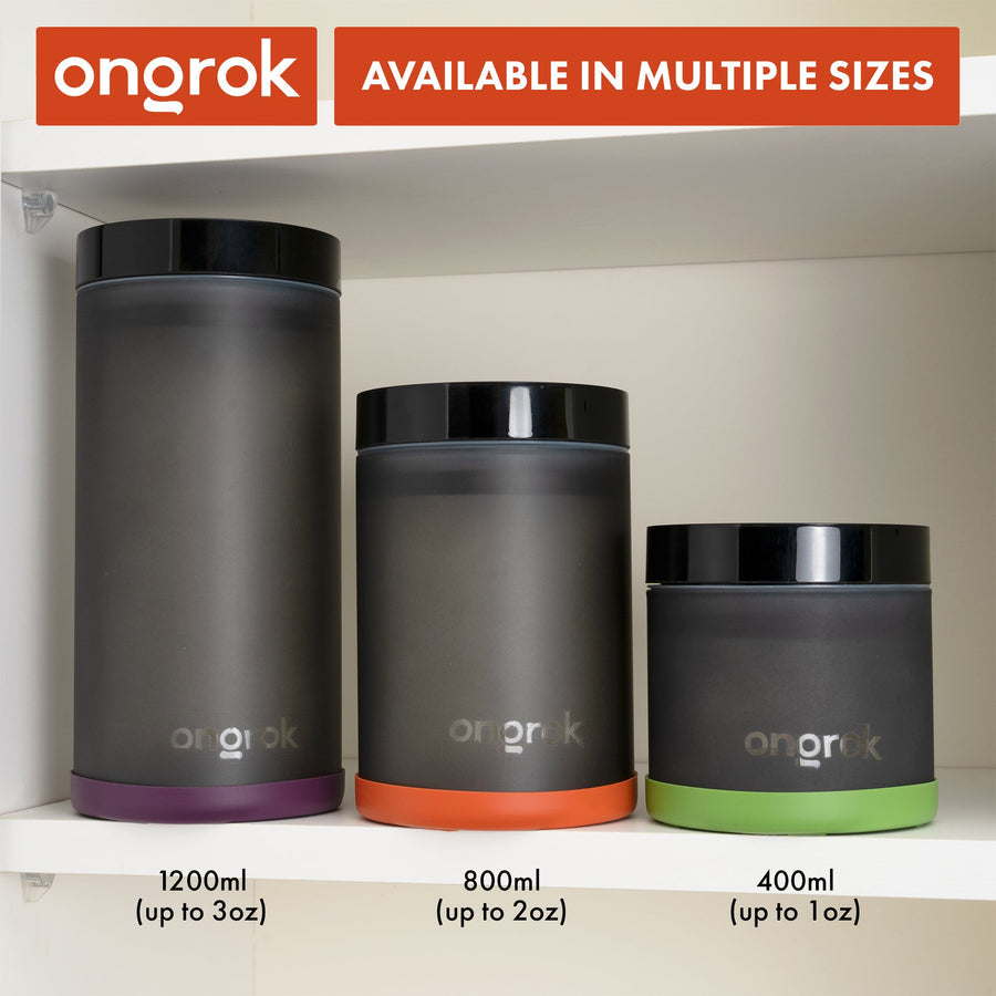 Airtight Vacuum Pump Storage Jar - Glass - 800ml on a shelf, featuring a vacuum-sealed lid and frosted UV-resistant glass for preserving herbs.