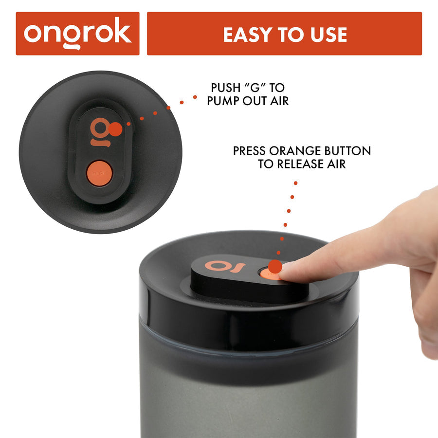A finger activates the vacuum-sealed lid of the Airtight Vacuum Pump Storage Jar - Glass - 800ml, showcasing its UV-resistant, frosted design for preserving herbs.