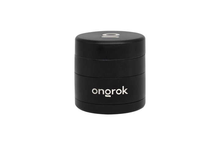 Mini EZ Grinder - 55mm, matte black, cylindrical, multi-piece with brand ongrok visible. Features include magnetic lid, deep storage, triangular teeth, and interchangeable bottom.