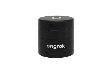 Mini EZ Grinder - 55mm, matte black, cylindrical, multi-piece with brand ongrok visible. Features include magnetic lid, deep storage, triangular teeth, and interchangeable bottom.