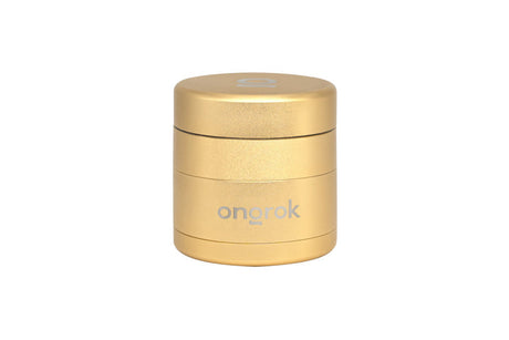 Mini EZ Grinder - 55mm, metallic-gold cylinder with ongrok branding, features stackable sections for grinding and storage, magnetic lid, and triangular aluminum teeth.