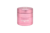 Mini EZ Grinder - 55mm: Compact cylindrical metallic pink grinder with a stylized O on the lid, featuring deep chambers and a magnetic locking system.