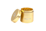 Mini EZ Grinder - 55mm, gold-colored, cylindrical, with interlocking teeth visible. Lid removed, displaying compact design and precision-engineered for consistent grinding. Brand name ongrok marked on body.