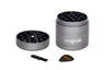 Mini EZ Grinder - 55mm: Disassembled 4-piece metal grinder with pyramid teeth, magnetic lid, and two accessories—a cleaning brush and scraper—for efficient herb processing.