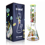 14 The Dreamer Beaker Bong by aLeaf, featuring a clear glass body with psychedelic mushroom artwork, alongside its matching branded gift box.