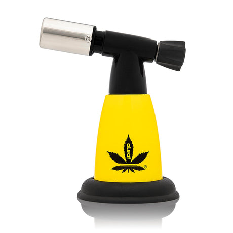 5 Blow Torch Turbo Flame with yellow body, black base, and nozzle, featuring a cannabis leaf logo. Ideal for heating concentrates with a 2500°F turbo flame.