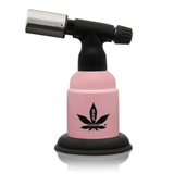 5 Blow Torch Turbo Flame with pink body, black base, and cannabis-leaf logo; offers 2500°F flame, ergonomic design for dabbing.