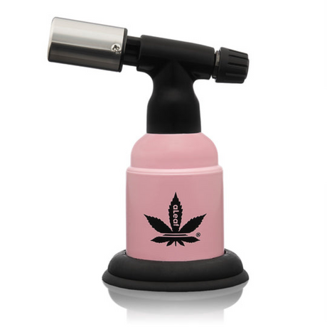 5 Blow Torch Turbo Flame with pink body, black base, and cannabis-leaf logo; offers 2500°F flame, ergonomic design for dabbing.