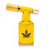 5 Brass Blow Torch Blue Turbo Flame, shiny gold finish, cannabis leaf logo, ideal for herb use, jewelry work, or culinary tasks; compact, sleek, refillable design.