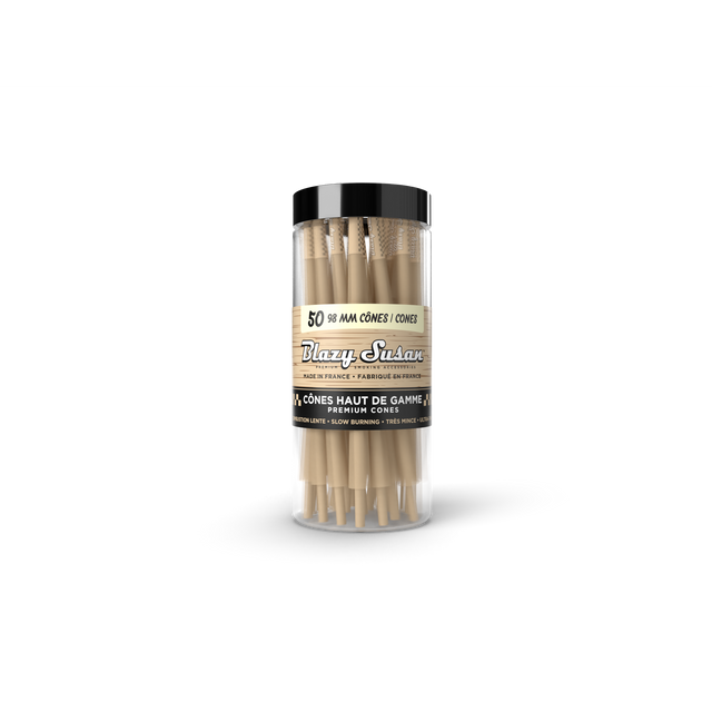 Blazy Susan Unbleached Pre-Rolled 98mm Cones in a clear tube with black lid, featuring 50 ultra-thin, slow-burning cones with built-in tips.