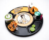 Blazy Susan Spinning Rolling Tray showcasing organized tools, grinders, papers, and accessories on a black circular platform with a central Blazy Susan logo.