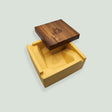 Briq Concrete Ashtray With Walnut Lid - Yellow, features a spiral design, solid concrete base, and a wooden lid with a logo on it.