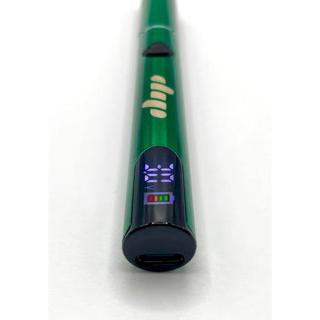 Lunar Dab Pen in metallic green with digital display showing 3.10 volts, power button, and USB-C port, highlighting its compact, efficient design for dabbing.
