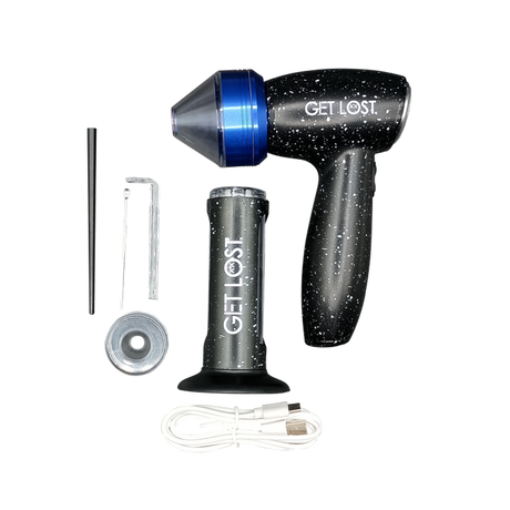 GET LOST dry-herb vaporizer kit includes a speckled vaporizer, base, packing tool, cleaning brush, hex key, metal piece, and USB charging cable.