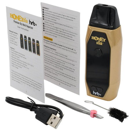 The HoneyStick HRB+ Dry Herb Vaporizer kit includes the vaporizer, user manual, USB cable, dab tool, tweezers, and a cleaning brush.