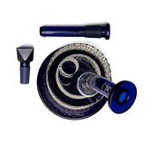 Twenties Collection Bubbler disassembled, showing cobalt-blue glass base with downstem, alongside separate bowl and slide, highlighting its ergonomic, stable design for versatile use.