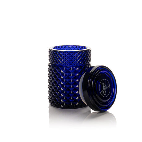 Twenties Collection Stash Jar, a deep-blue, diamond-textured cylindrical container with matching lid, showcases premium borosilicate glass design and durable, airtight storage.