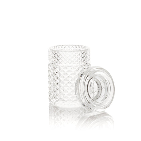 Twenties Collection Stash Jar: A clear, textured glass jar with matching lid, featuring a diamond-cut pattern and airtight seal for secure, elegant storage.
