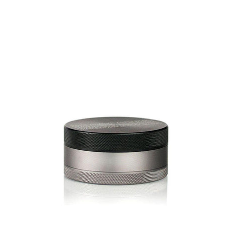 Kannastör 4pcs Aluminum 2.5 Solid Body Grinder with Storage, featuring a round metal design with a black and silver band, ideal for portable use.