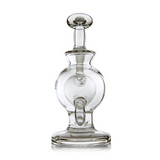 Atlas Mini Dab Rig - Clear: A compact, hand-blown glass rig with a rounded chamber, flared mouthpiece, and double ball design for smooth, flavorful hits.