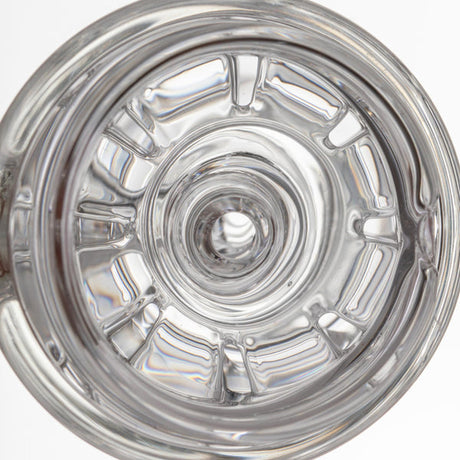 Top view of empty clear glass tumbler, reflecting light, showcasing the craftsmanship of the Halo Peak Attachment from the Alpine Collection by MJ Arsenal.