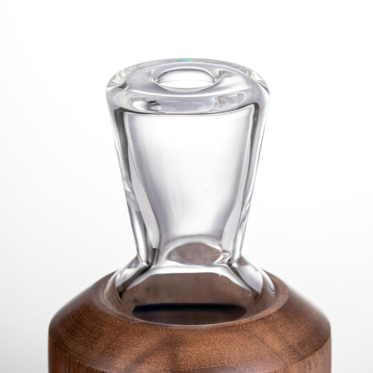 Halo Peak Attachment - Alpine Collection: A clear glass funnel-shaped piece with a wide mouth set into a smooth, round wooden base, showcasing elegant craftsmanship.