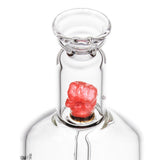 Close-up of MJA x Tyson 2.0 Punch-Out Bubbler, featuring a red gummy-bear percolator and signature boxing glove encased in borosilicate glass.