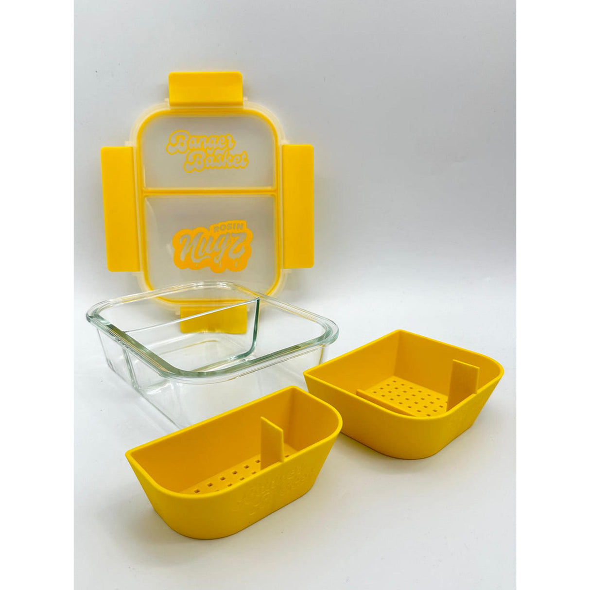 Banger Basket showing yellow containers with sealable lids and holes, designed for cleaning dabbing tools with two compartments and convenient handle.