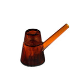 Deco Bubbler: An amber-tinted, ribbed-glass pitcher with a narrow spout and small filling opening, blending vintage elegance with modern functionality.