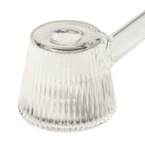 Deco Bubbler: A clear, fluted-glass pouring vessel with a ribbed pattern, side spout, and circular opening, blending Art Deco elegance with modern functionality.