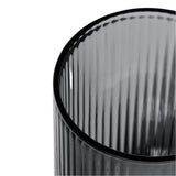 Close-up of the Deco Gravity Bong, showcasing its translucent gray, fluted glass construction, reflecting vintage Art Deco elegance and modern functionality.