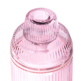 Deco Gravity Bong in ribbed pink-tinted glass, showcasing stacked strainer cap and lid with vertical flutes, blending vintage elegance and modern functionality.