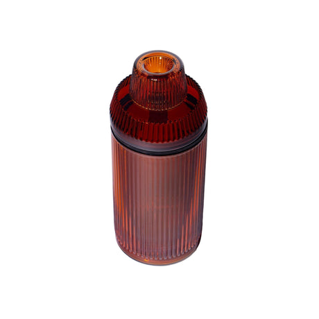 Deco Gravity Bong: Amber-colored, cylindrical container with ribbed design, showcasing Art Deco elegance and modern functionality, made from premium borosilicate glass for smooth, gravity-powered use.