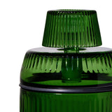 Deco Gravity Bong close-up showing green ribbed translucent vessel with fluted knob, circular sealing lip, and matching lid, highlighting Art Deco-inspired design and modern functionality.