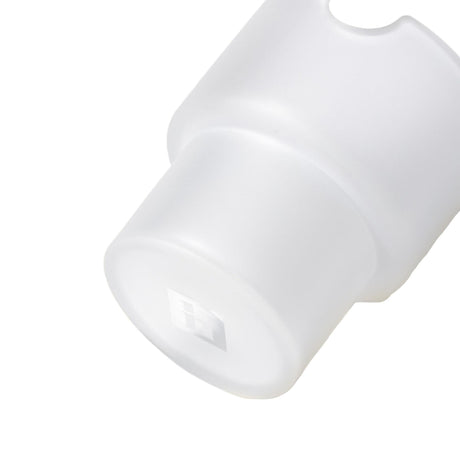 Close-up of a milky-white plastic cap, embossed with H, resembling a diffuser for the Flower Pots Ashtray Set, showcasing minimalist design and functionality.