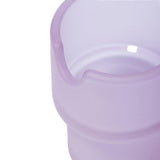 Close-up of the Flower Pots Ashtray Set, highlighting a lavender silicone cup with a frosted exterior, smooth interior, and a pour-spout notch.