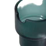 Close-up of a dark green ceramic vessel with a glossy turquoise-green interior and a pouring spout, emphasizing the Flower Pots Ashtray Set's modern, functional art design.
