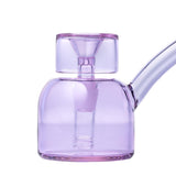 Vesper Bubbler: Compact purple glass water pipe with rounded chamber, short percolator, and slanted mouthpiece. Handcrafted, mid-century inspired design for smooth, elegant use.