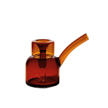 Vesper Bubbler in amber-tinted glass with rounded base, angled mouthpiece, and bowl on top, showcasing a sleek, modern design for smooth water-filtered use.