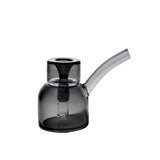 Vesper Bubbler in smoky-gray glass features a rounded chamber, angled mouthpiece, and built-in diffuser, embodying modern elegance and functionality for smooth, water-filtered pulls.