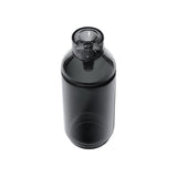 Vesper Gravity Bong, a dark-smoke-tinted cylindrical glass vessel with a screw-on lid and round pour opening, against a white background.