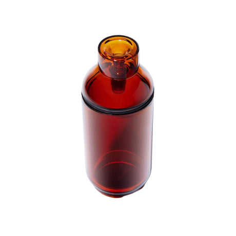 Amber-colored Vesper Gravity Bong, a sleek, cylindrical vessel with a threaded neck and cap, showcasing minimalist design and smooth, effortless functionality.