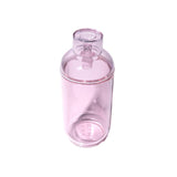Vesper Gravity Bong, a tall, cylindrical reusable bottle with a screw-on lid and spout, crafted from translucent material for smooth, effortless use.