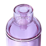 Vesper Gravity Bong, a sleek purple-tinted glass vessel with stopper and metallic accent, showcases elegant design and precision-engineered gravity function for smooth hits.