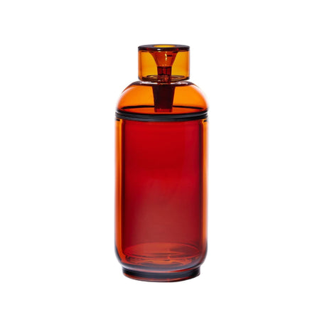 Vesper Gravity Bong: A tall, translucent red/orange cylindrical bong with a screw-on cap and built-in straw, showcasing modern elegance in durable borosilicate glass.