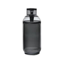 Vesper Gravity Bong, a sleek, smoke-gray cylindrical container with a matching lid, crafted from premium borosilicate glass, designed for smooth, gravity-powered smoking.