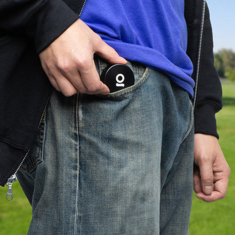 2pcs Metal 2 Magnetic Grinder being placed in a denim pocket, showcasing its compact, portable design suitable for on-the-go use.