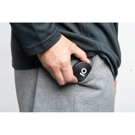 Person holding a 2pcs Metal 2 Magnetic Grinder in pocket; compact, durable, aircraft-grade aluminum, ideal for portable use.